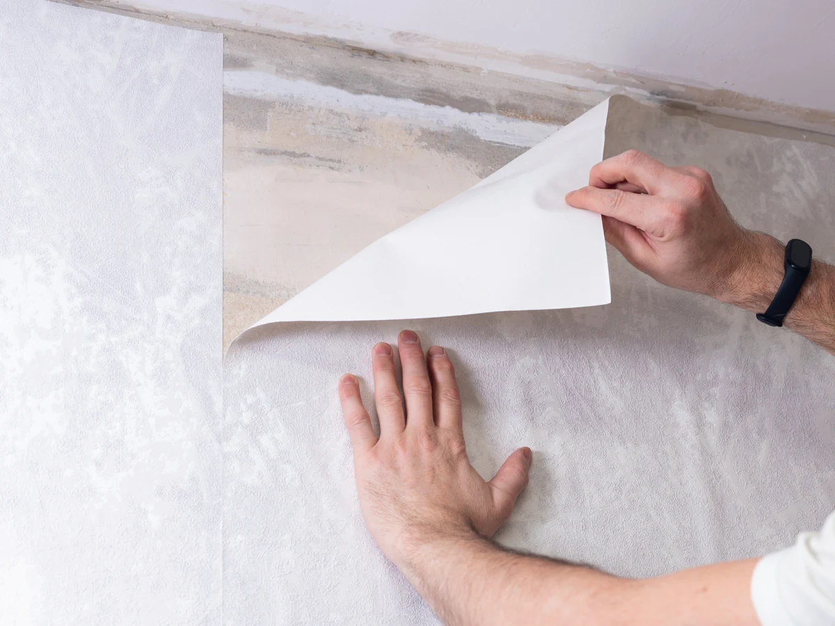 wallpapering-hands-peeling-applying-worthing-decorators Wallpapering Costs in Worthing for Worthing Painters